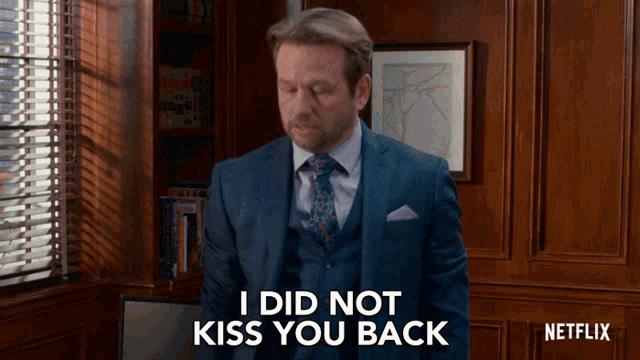 a man in a suit and tie is saying i did not kiss you back