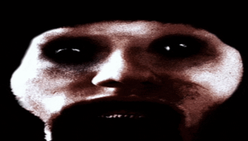 a close up of a person 's face with a black background