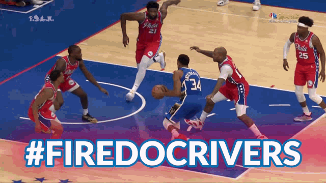 a philadelphia basketball game is being played on a blue court