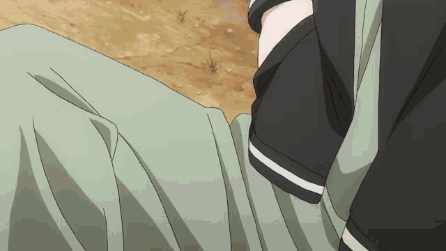 a close up of a person 's pants with a black shirt