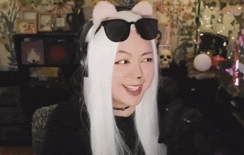 a woman wearing sunglasses and a headband with cat ears