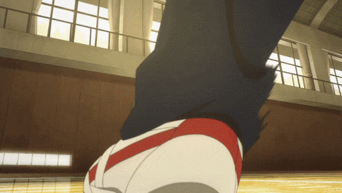 a person 's feet are shown with a red stripe on the side
