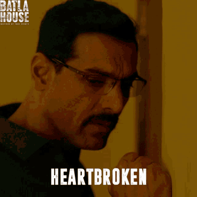 a man with glasses and a mustache is knocking on a door and the word heartbroken is on the bottom