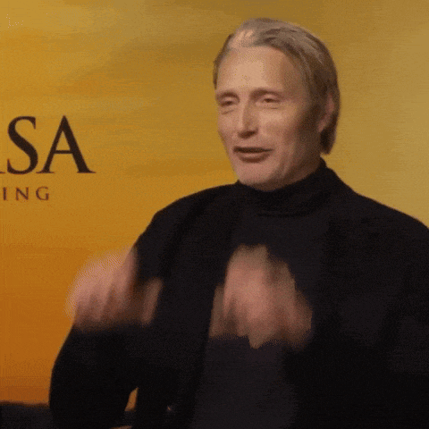 a man in front of a sign that says sa
