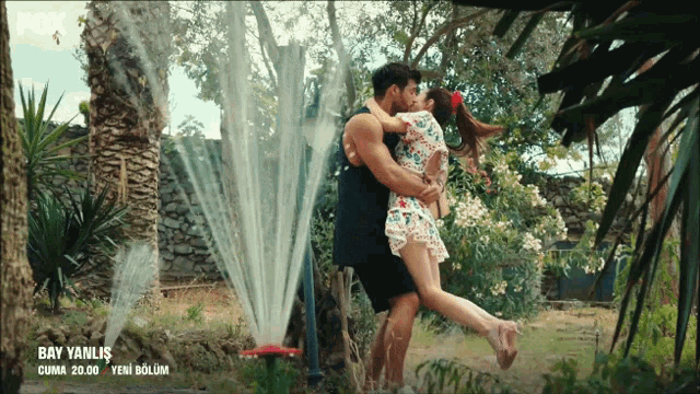 a man is holding a woman in his arms and says bay yanlis on the bottom