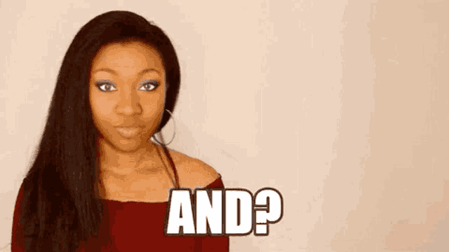 a woman in a red top is making a funny face and says `` and ? ''
