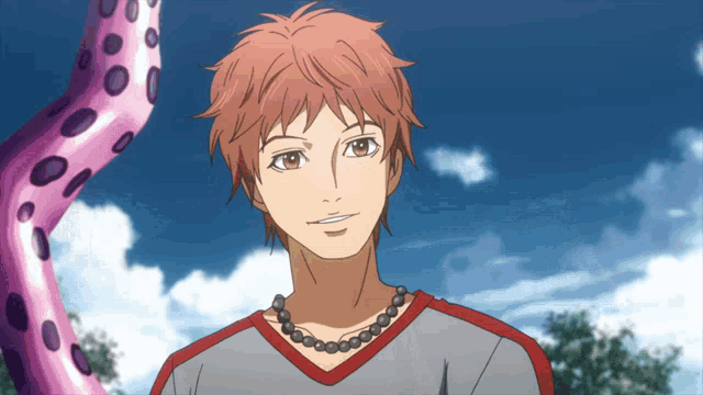 a man with a necklace around his neck is smiling