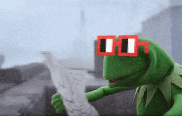 kermit the frog is wearing a pair of red and white striped sunglasses and reading a newspaper .