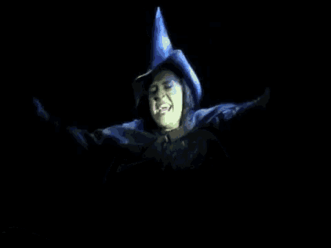 the wicked witch from the wizard of oz is shown in a dark room