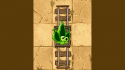 a green plant is laying on top of a wooden train track .