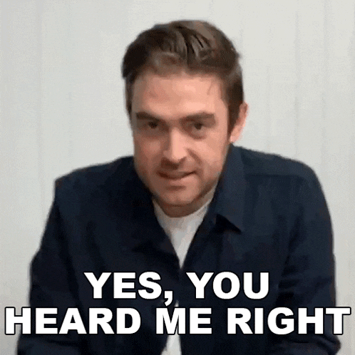 a man in a blue shirt is making a funny face and says `` yes , you heard me right '' .