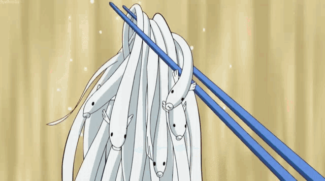 a man with blue hair is eating with chopsticks