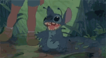a person is standing next to a cartoon character named stitch