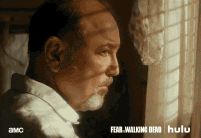 an ad for fear walking dead shows a man looking out of a window