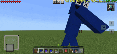 a screenshot of a minecraft game shows a cookie monster standing in a field