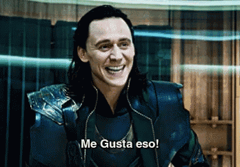 a man with long hair is smiling and says me gusta eso !