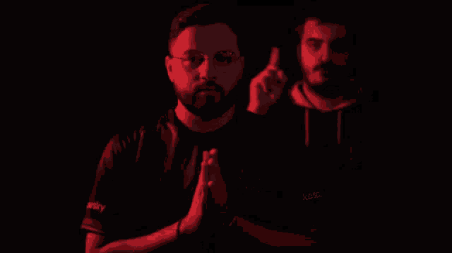 two men standing next to each other one wearing a shirt that says xtreme