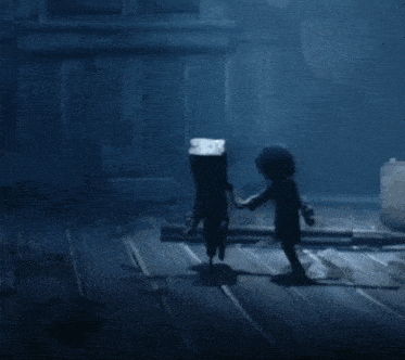 a shadow of a person is walking on a wooden floor in a dark room .