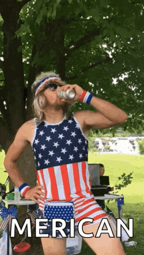 a man in an american flag outfit is drinking a beer