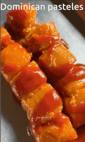 a close up of a skewer of food with the words dominican pasteles below it