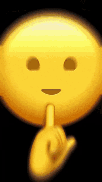 a smiley face with a finger on its lips