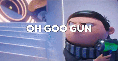a cartoon character from despicable me is holding a gun and says `` oh goo gun '' .