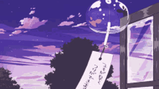 a wind chime hangs from a window with a purple sky in the background