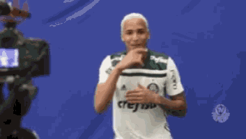 a man wearing a green and white jersey that says reissa