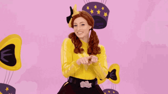 a woman in a yellow shirt that says wiggle on it