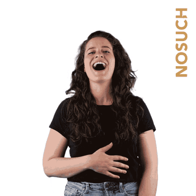 a woman in a black shirt is laughing in front of a no such sticker