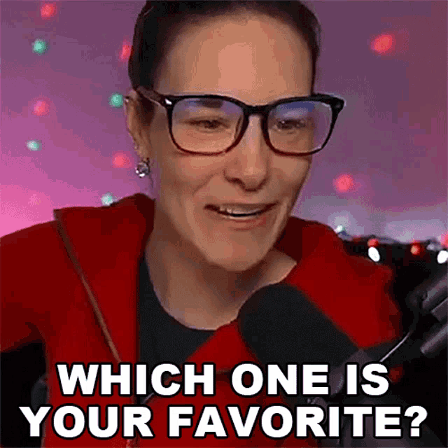 a woman wearing glasses is talking into a microphone and asking which one is your favorite