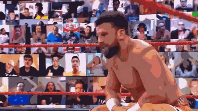 a man in a wrestling ring with a w logo