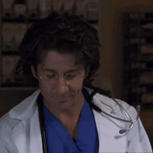 a doctor with a stethoscope around his neck and glasses