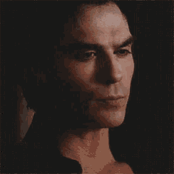 a close up of a man 's face with his eyes closed