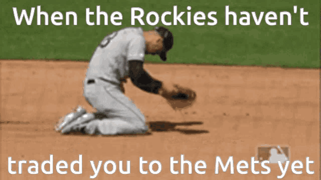 a baseball player kneeling on the field with the caption when the rockies haven t traded you to the mets yet