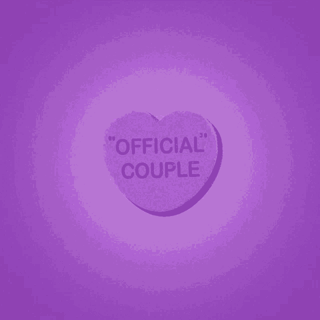 a heart shaped candy that says " official couple " on it