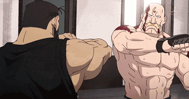two muscular men are fighting each other in a room and one of them has blood on his face