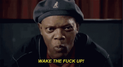a man wearing a kangol hat says " wake the fuck up "