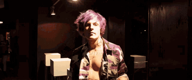 a person with purple hair has a tattoo on their chest that says ' i love you '