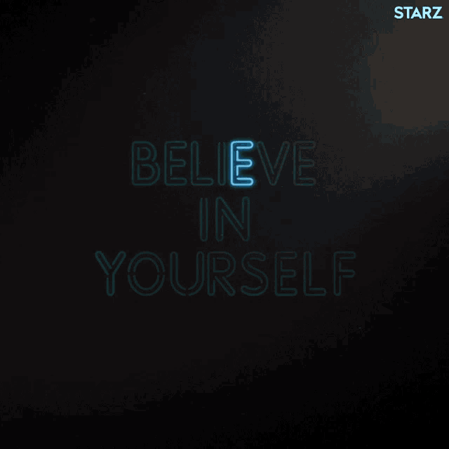 a neon sign that says " believe in yourself " on a dark background