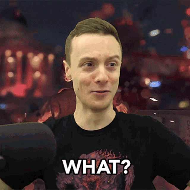 a man is wearing a black shirt that says what on it