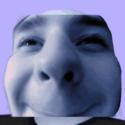 a close up of a man 's face with his eyes closed