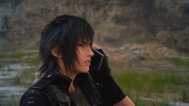 a man with black hair is talking on a cellphone