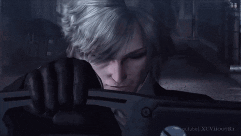 a close up of a man holding a gun with youtube xcvioo r1 written on the bottom right