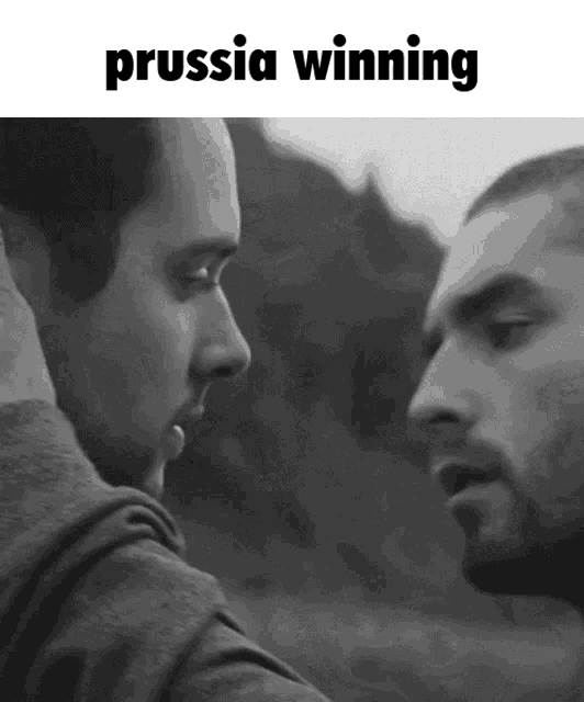a black and white photo of two men with the words prussia winning below them
