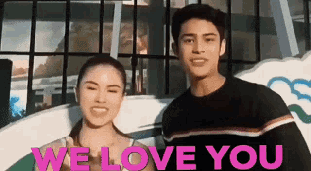 a man and a woman are standing next to each other with the words `` we love you '' written on the bottom .