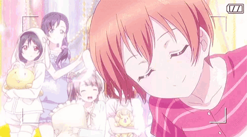 a group of anime girls taking a selfie with a camera .