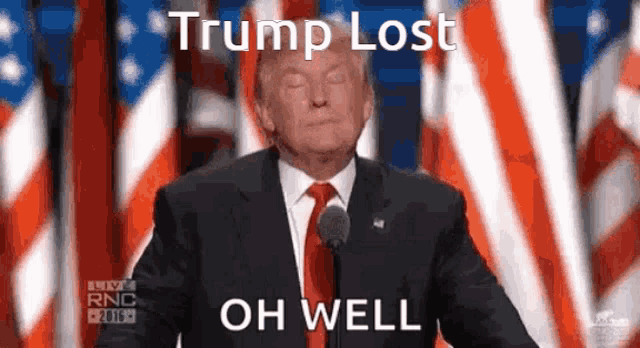 a man in a suit and tie is giving a speech with the words trump lost oh well