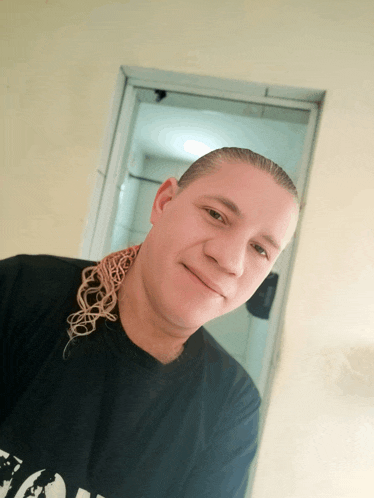 a man wearing a black t-shirt that says ' nc ' on it