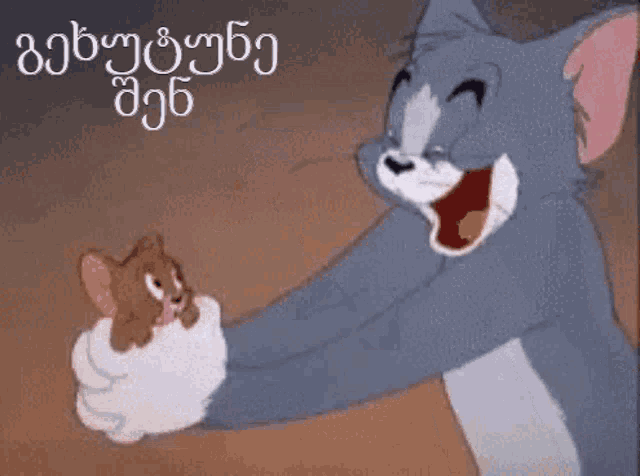 a cartoon of tom and jerry with a foreign language behind them